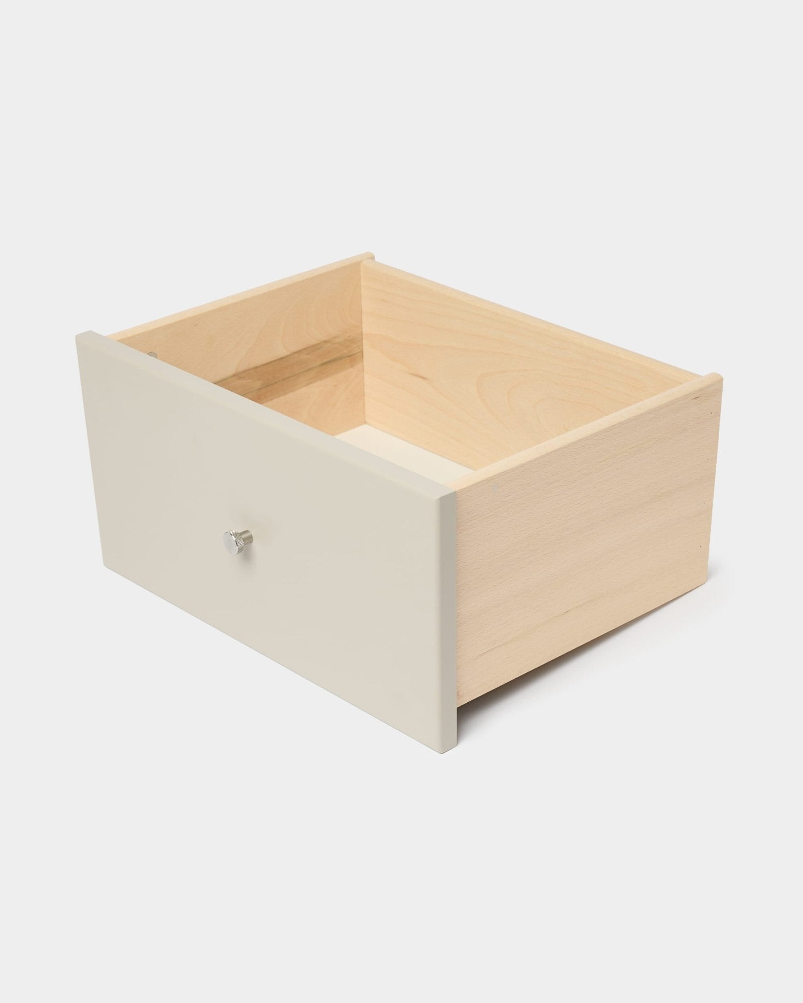 Gaveta para estante WoodUpp Arka em bege, com painel frontal e puxador brancos, concebida para arrumação fechada, apresentada num fundo branco liso.