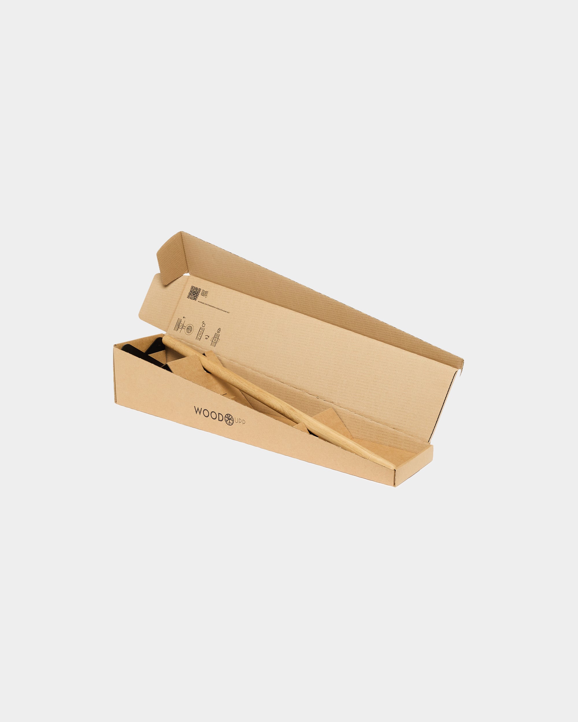 Wooden acoustic accessories in an open rectangular box with WOOD and a logo on the side, placed against a white background.